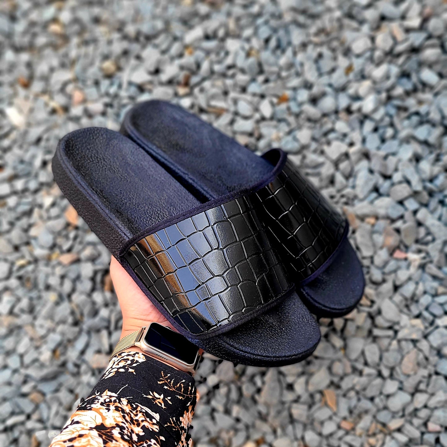 The Wax Crest Slides Embossed Black.